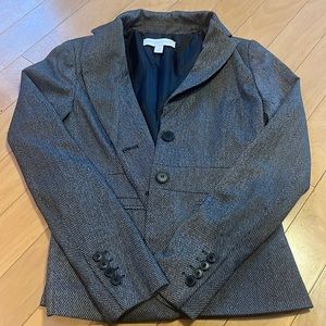 This is a New york and company grey, black, and white blazer size 0.